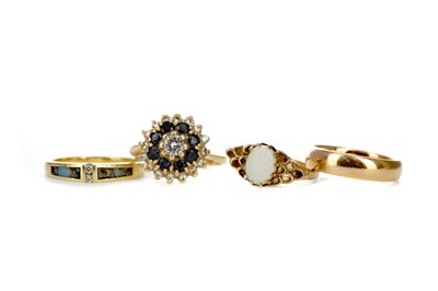 Lot 471 - A SAPPHIRE AND DIAMOND CLUSTER RING ALONG WITH THREE OTHERS
