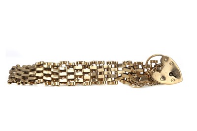 Lot 472 - A NINE CARAT GOLD GATELINK BRACELET