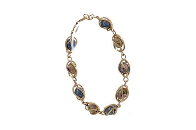 Lot 1330 - A GOLD AND ENAMEL BEAD BRACELET