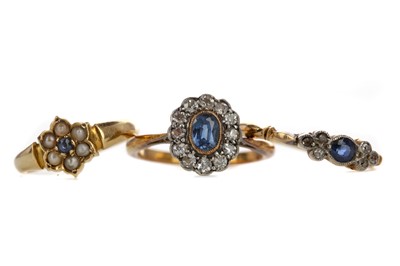Lot 1375 - THREE BLUE GEM SET RINGS