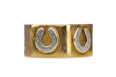 Lot 1447 - A GOLD HEXAGONAL HORSESHOE RING