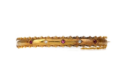 Lot 1506 - A VICTORIAN RED GEM SET AND DIAMOND BANGLE