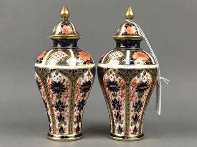 Lot 818 - A PAIR OF ROYAL CROWN DERBY IMARI PATTERN URNS