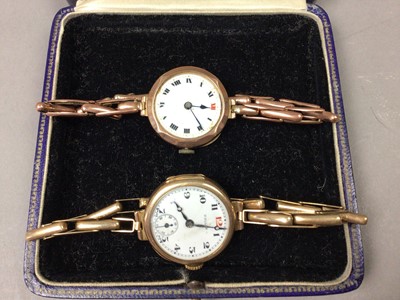 Lot 559 - A LOT OF TWO EARLY 20TH CENTURY LADY'S GOLD BRACELET WATCHES