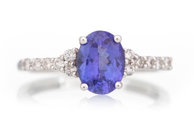 Lot 657 - TANZANITE AND DIAMOND DRESS RING