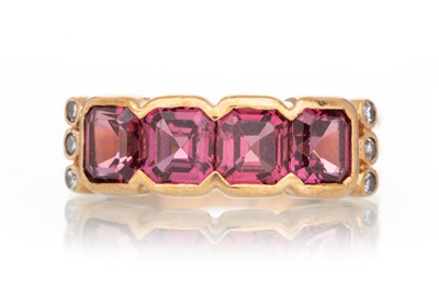 Lot 679 - RHODOLITE GARNET AND DIAMOND RING