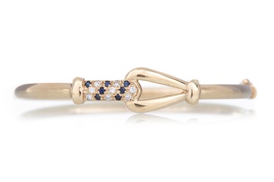 Lot 712 - SAPPHIRE AND DIAMOND BANGLE