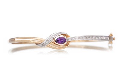 Lot 744 - AMETHYST AND DIAMOND BANGLE