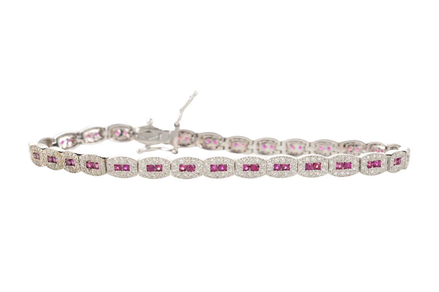 Lot 545 - RUBY AND DIAMOND BRACELET,